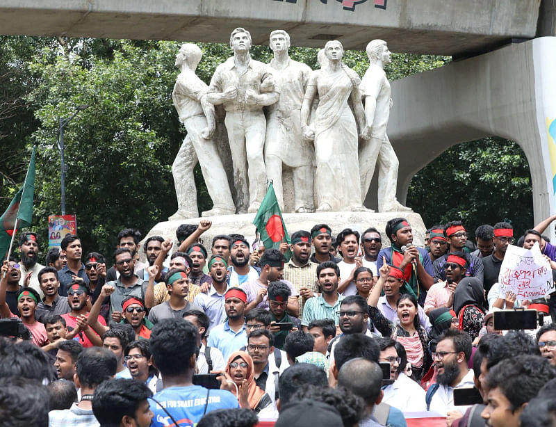 In this file photo, the  quota reform protesters demonstrate at the Raju Memorial Sculpture of Dhaka University on Monday.